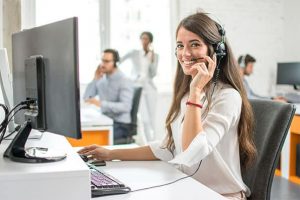 An image featuring a customer service support agent working in a call center